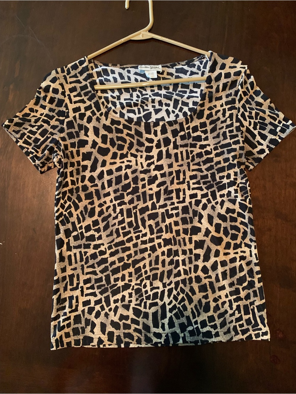 Women’s black and tan short sleeve top size Medium.
